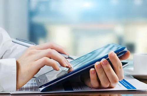 person using a tablet to fill out a form
