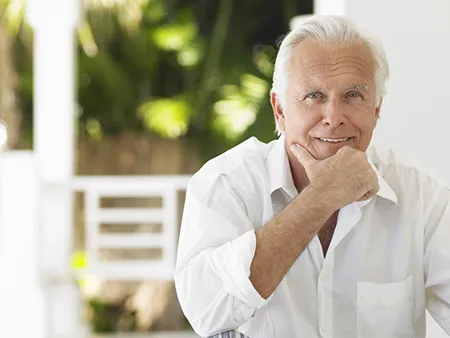 smiling man thinking about dental care